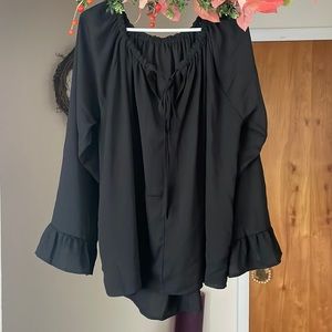 Women’s Boho oversize long-sleeve blouse with ruffled cuff.